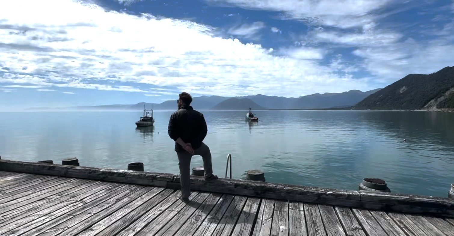 A man admiring Jackson Bay, New Zealand